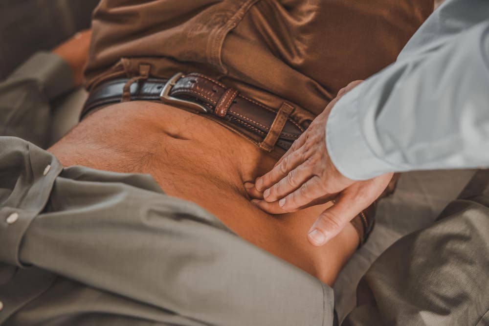 Doctor checking patient's Stomach